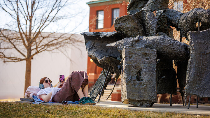 Lillian Bittle, a freshman Journalism major, studies art history while relaxing under the “Birth of Venus” sculpture on a warm February day.