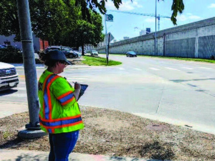 BOSR employee standing at intersection for the Seatbelt Study